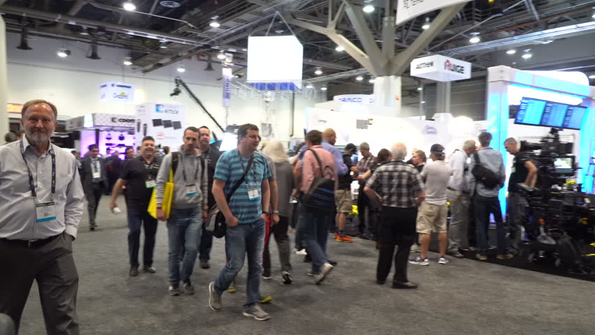 People Walking On A Trade Show Floor